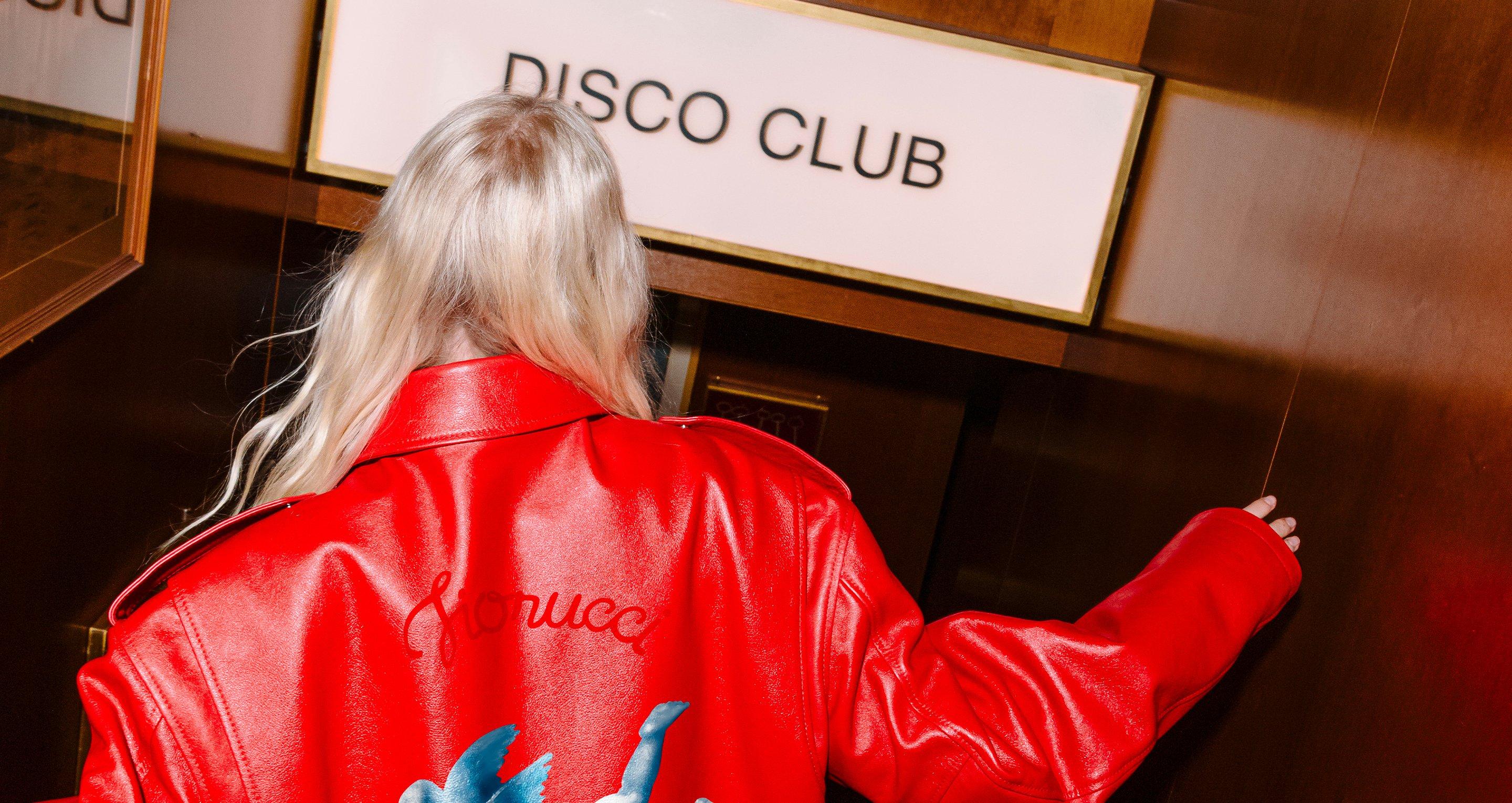 Model is wearing the Cupid Leather Jacket in Red.